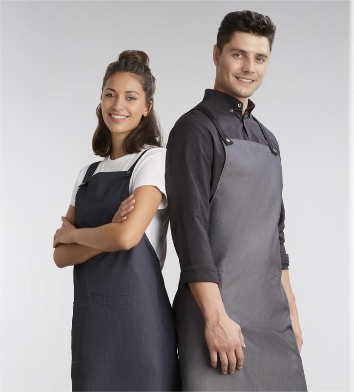 Custom hospitality uniforms including aprons, chef jackets, and barwear with logo embroidery